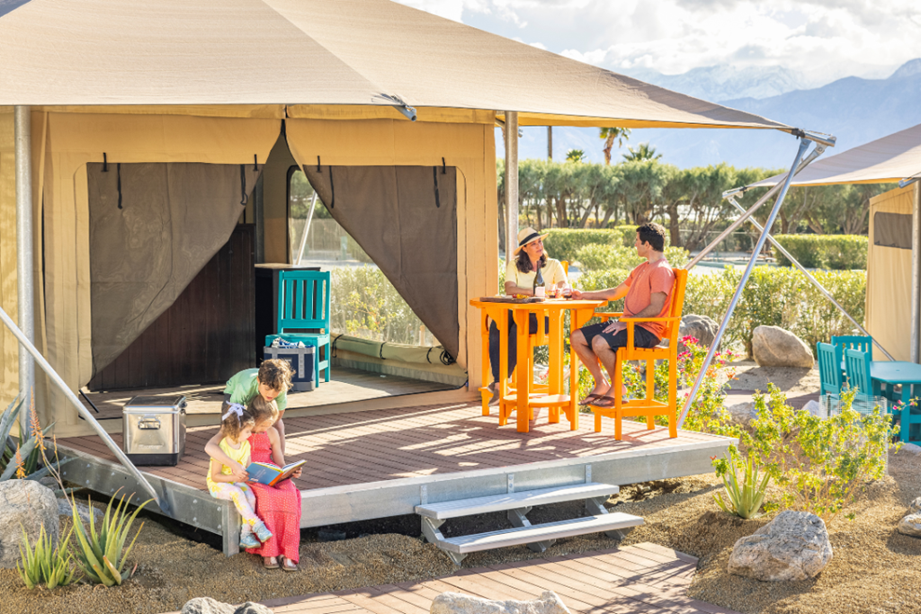 Shot of a family of four with kids at a glamping Eco Tent at Palm Springs Joshua Tree KOA Holiday California